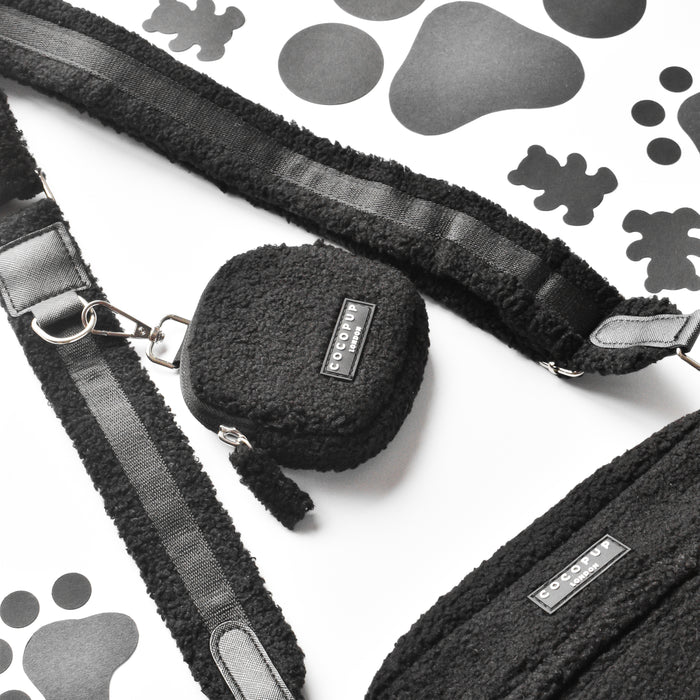 Cocopup London Teddy Baloo treat pouch on a white surface with black paw print pattern.
