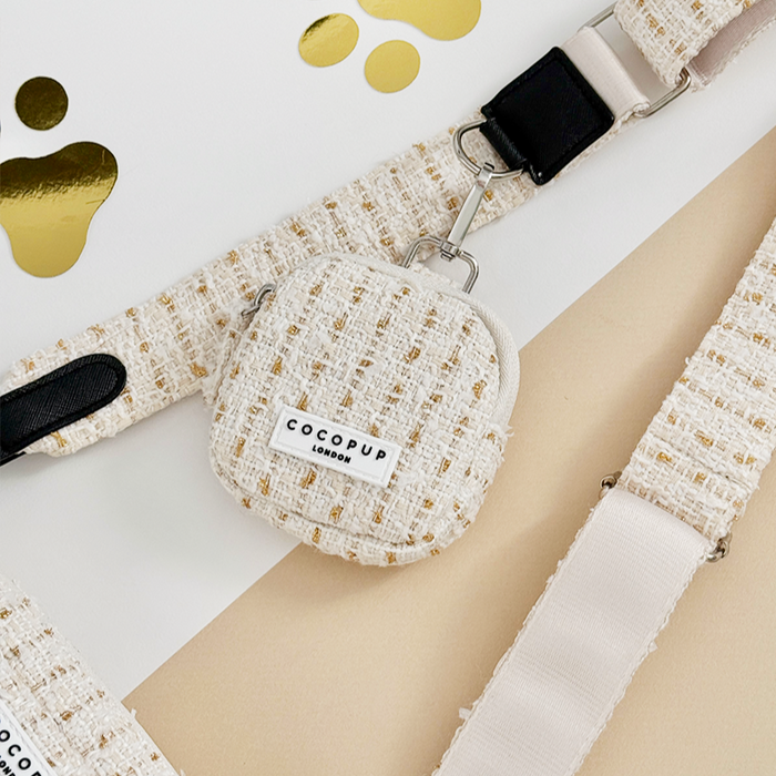 Vanilla textured tweed treat pouch from Cocopup London with gold confetti accents.