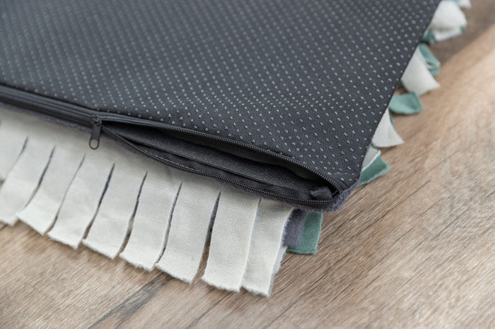 Underside of the Trixie snuffle mat showing the non-slip base and tray zip