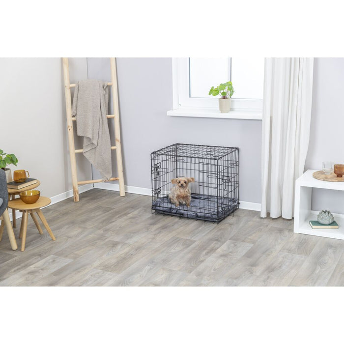 Small dog inside the Trixie Dog Crate Home in a living room