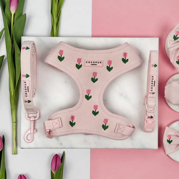 Pink dog harness, lead and collar with tulip embroidery design and Cocopup logo.