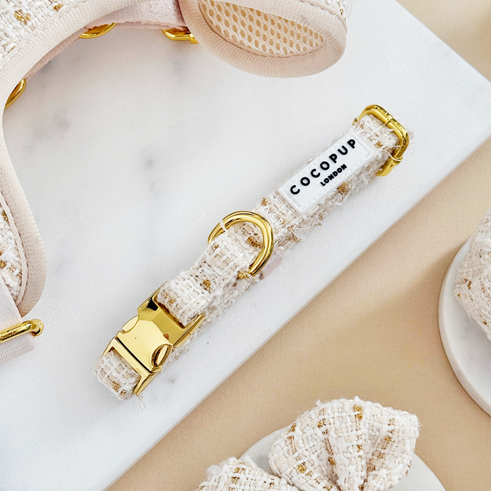 Vanilla textured tweed dog collar with gold buckle and Cocopup London label on a white background.