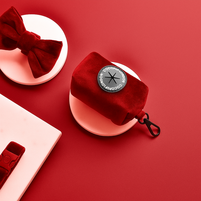 Berry red velvet poop bag holder with gold zipper and clip, from Cocopup London.