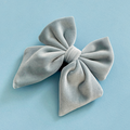 Baby blue velvet dog sailor bow tie with four loops.