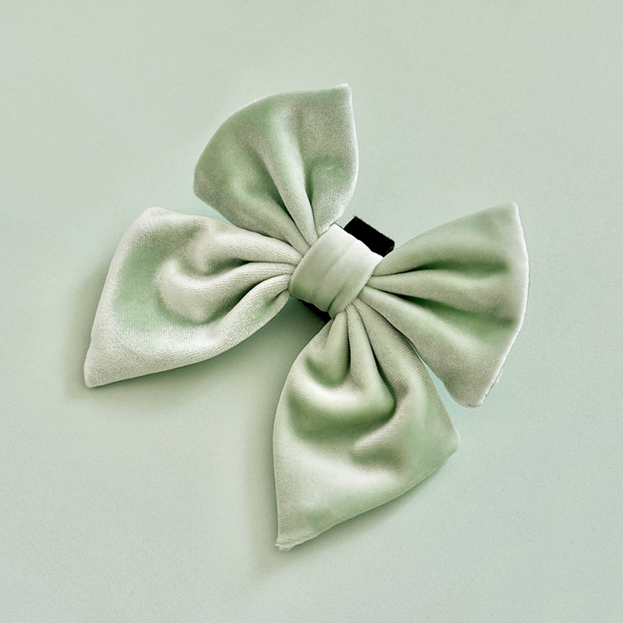 Sage green velvet sailor bow tie with a black center clasp by Cocopup London.