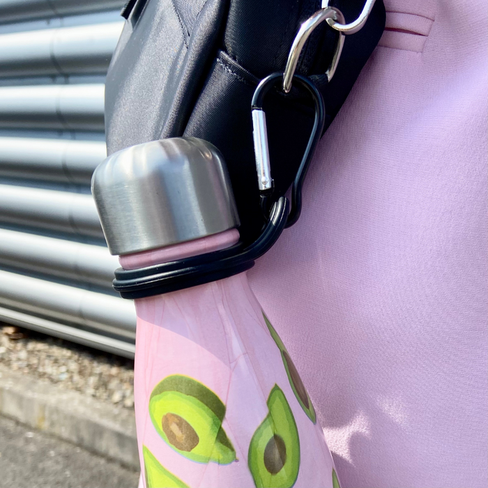 Cocopup London water bottle holder clip in black metal, securely fastening a bottle to a bag for easy carrying.