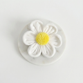 White flower with yellow centre, to attach to Dog Harness or Collar.